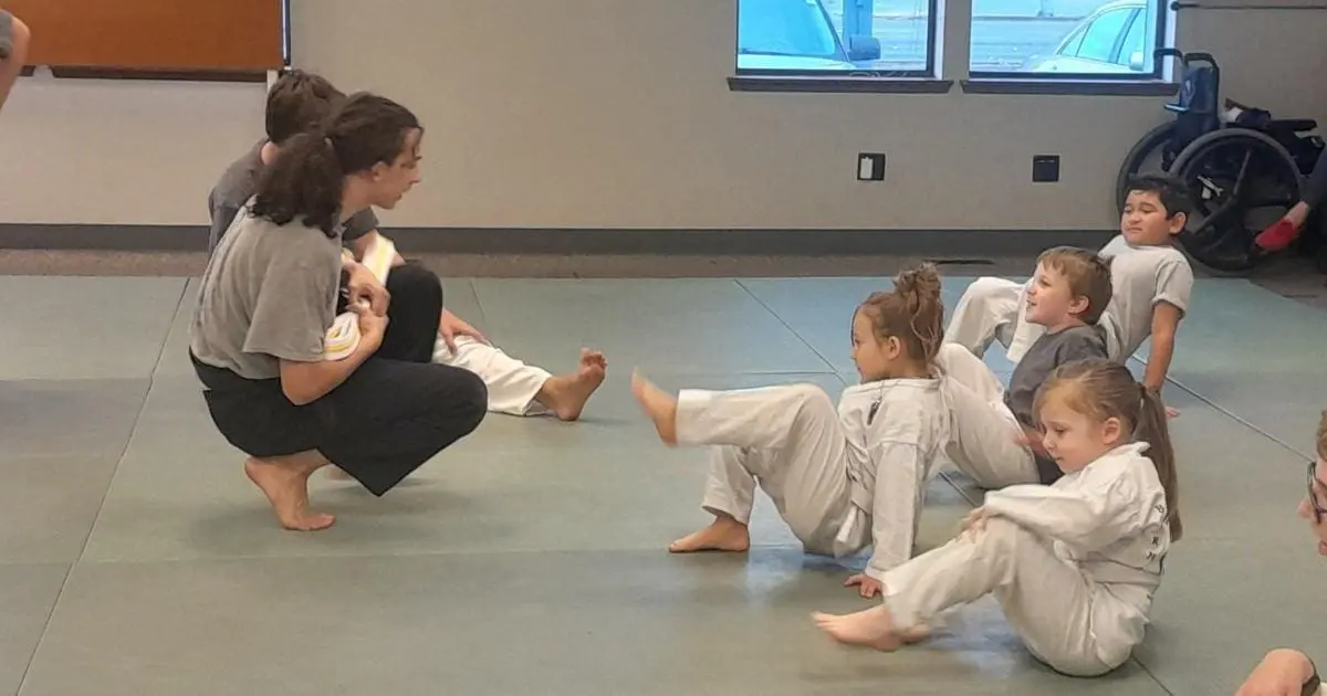 instructor teaching martial arts fundamentals