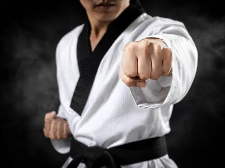 student throwing a punch for adult martial arts class