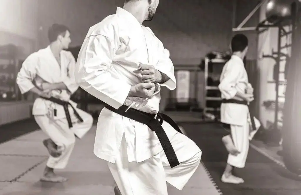 adult doing stances for adult martial arts class