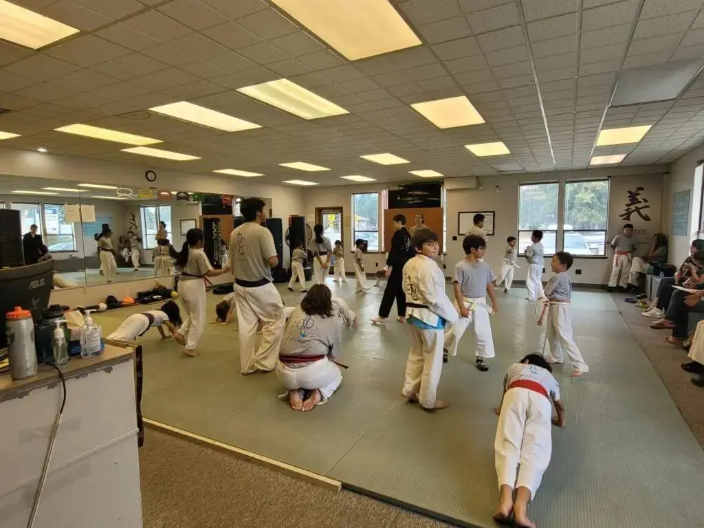 group of students doing workouts during an adult martial arts class